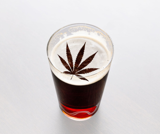 an image  of a pint with a marijuana leaf in the foam