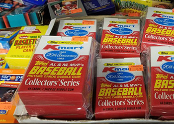a pile of old baseball card packs in a box