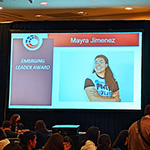 a screen showing a picture of AJ advocacy manager Mayra Jimenez and with the words "emerging leader award"
